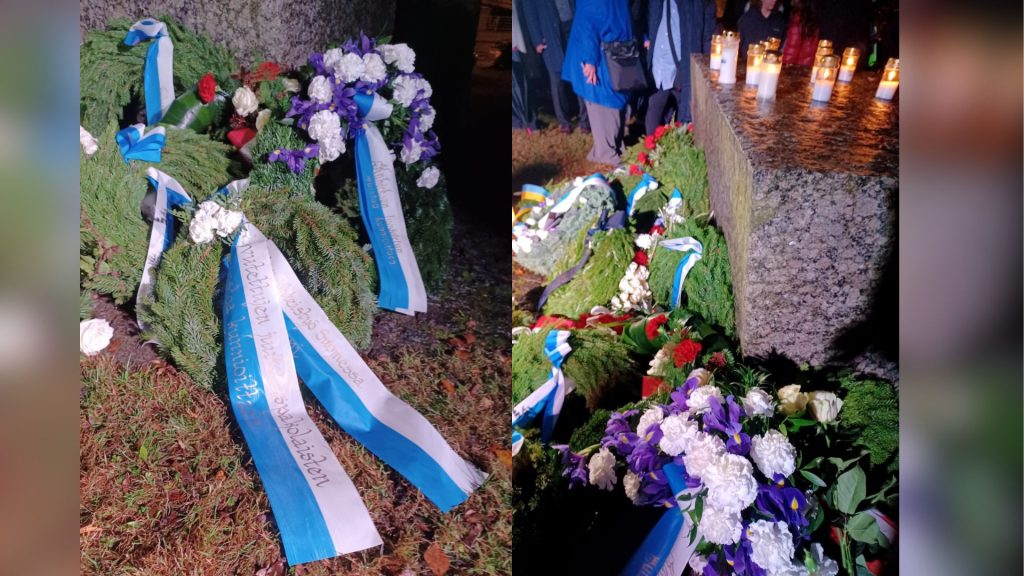 Seppeleitä ja kynttilöitä haudalla.